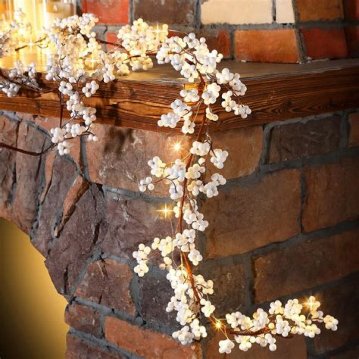 A white garland and lights festive background.