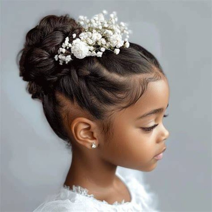 Little bride hairdo with braids and twists Little bride hairdo with braids and twists